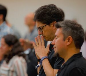 Ricardo and another person praying